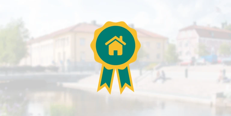 En emblem med en fastighet i.